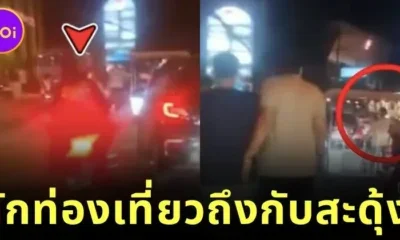Thai teenagers hit Indian tourists on the back with a cane for walking on the road blocking traffic
